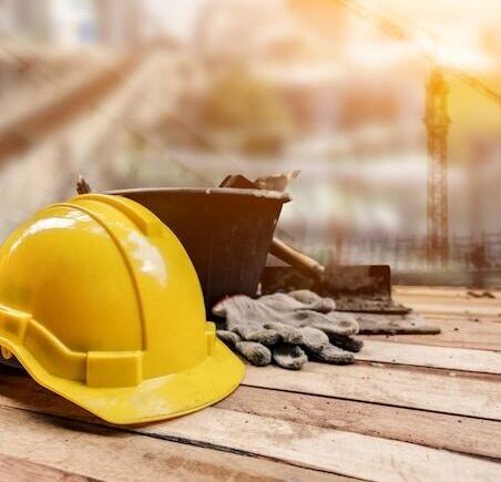 Premium Photo _ Equipment and tools for building construction on wood background_ Labor day and worker concept_ casco de construccion